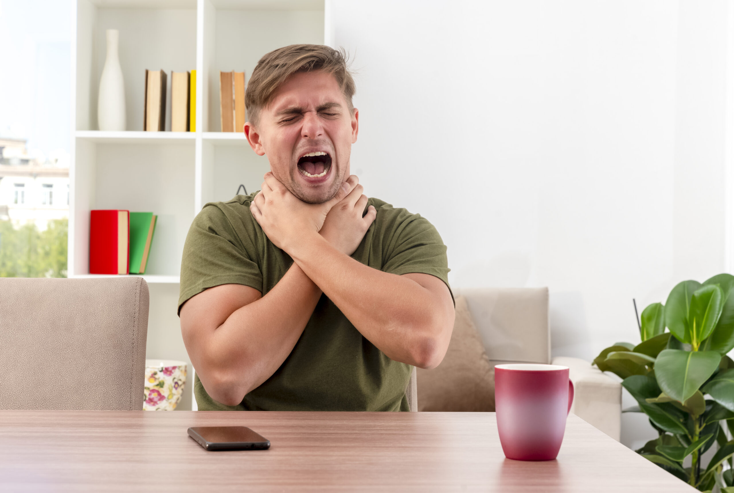 https://www.freepik.com/free-photo/annoyed-young-blonde-handsome-man-sits-table-with-phone-cup-choking-himself-with-two-hands-inside-living-room_13382832.htm#fromView=search&page=1&position=50&uuid=d376064a-3ddb-4a75-a851-ceac30ae2735