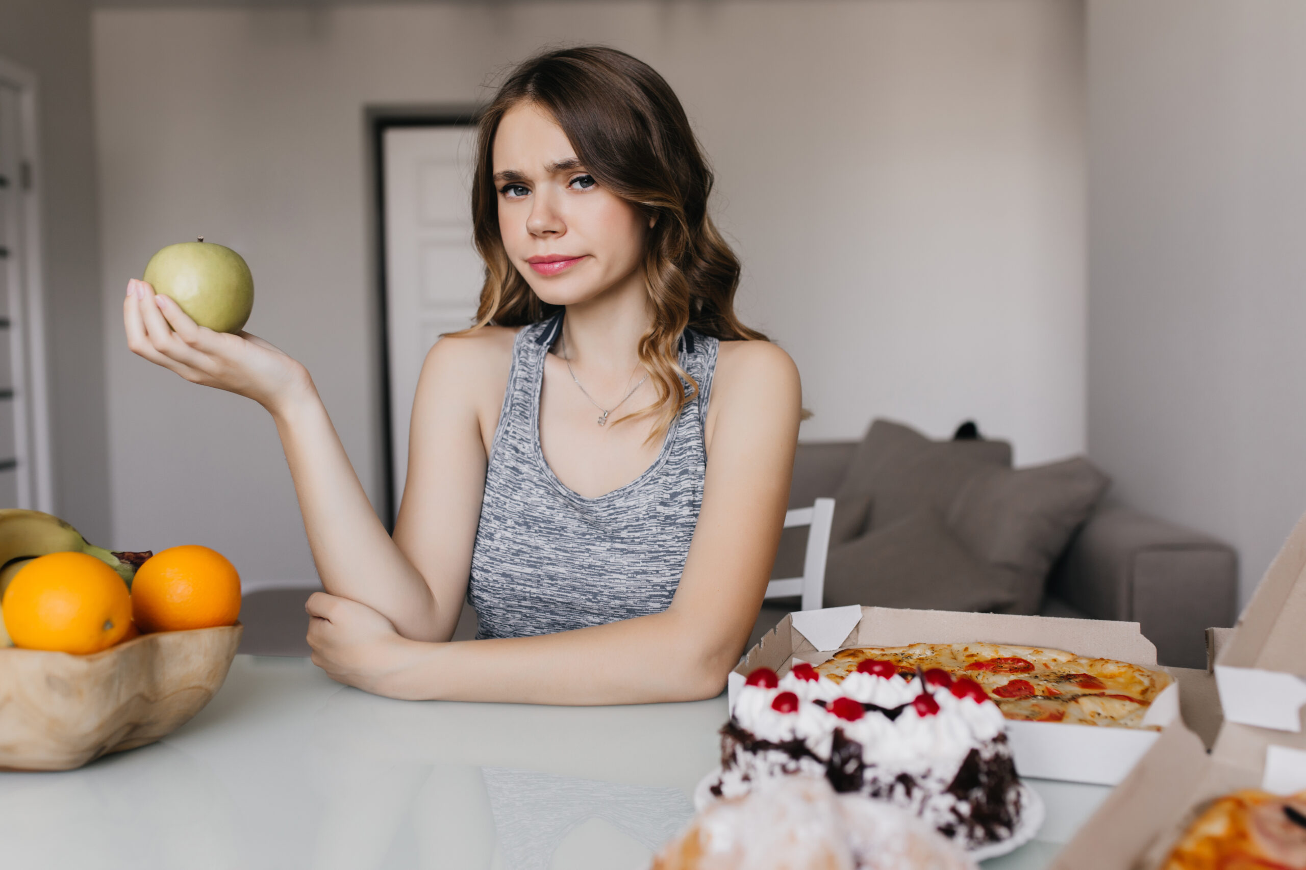 https://www.freepik.com/free-photo/pensive-caucasian-girl-thinking-about-her-diet-holding-apple-indoor-photo-serious-curly-woman-posing-table-with-healthy-food-pizza_11455022.htm#fromView=search&page=2&position=3&uuid=7867a8da-c78b-453b-9016-8c5976b73158&query=Could+Your+Diet+Be+Causing+Cramps%3F+Foods+to+Avoid